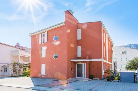 The island of Krk, Baška, attractive apartment surface area 120.35 m2 for sale, on the ground floor of a residential building with own garden. The apartment is divided into two separate apartments. The apartments consist of living room, kitchen, dini...