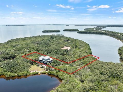 Welcome home to your very one Private island Oasis in this amazing waterfront retreat located in the private Island living of the gated community called 