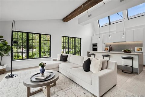 Welcome to Residence 207 at The Mill Westport, a spectacular corner unit with spacious rooftop deck which offers high-end luxury living with all the amenities of a fine custom home in the heart of downtown Westport. With a concierge on-site and appro...