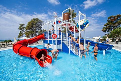 4-star apartments in a family-friendly holiday complex on a long, sheltered bay near the town of Nin, on 100 hectares of land surrounded by pine trees. The nearly 2 km long gently sloping beach with mainly sandy seabed is ideal for children and non-s...