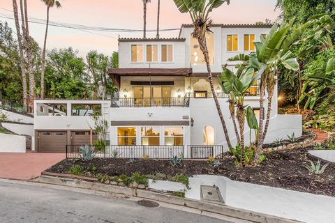 Welcome to your Hollywood Hills haven, perched majestically above the iconic Sunset Strip. This exquisite property, reminiscent of the enchanting Spanish Mediterranean architecture of the 1920s, is a rare gem boasting a double lot, inviting you to em...