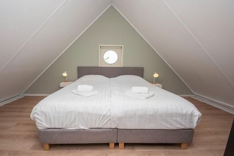 Waterfront Escape Discover a serene retreat at this beautiful holiday home in Terherne, where comfort meets adventure. The spacious and bright villa is designed for families and tranquility seekers, offering a private garden with a jetty and direct a...