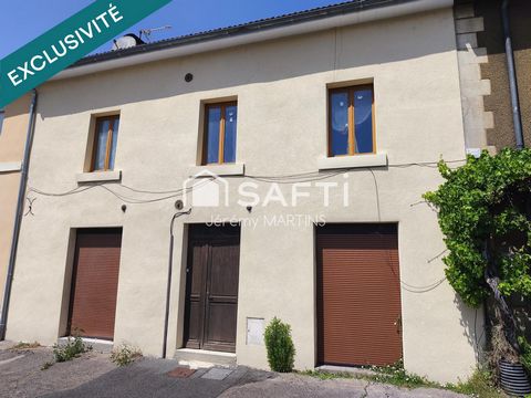 Maison de ville avec garage et terrain
