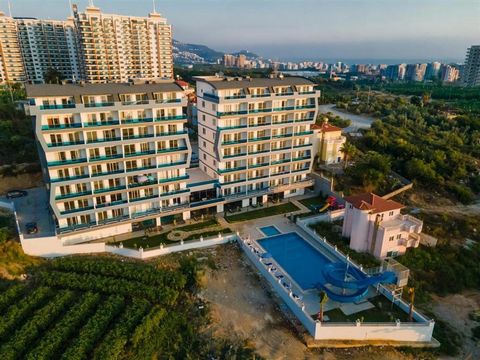 Mahmutlar, Alanya – Exodus Residentie 1 slaapkamer • 1e verdieping • Volledig gemeubileerd • Uitzicht op zee, kasteel en bergen   Op zoek naar een kant-en-klaar vastgoedbelegging aan de Turkse Rivièra? Dit appartement in Exodus Residence , een van de...