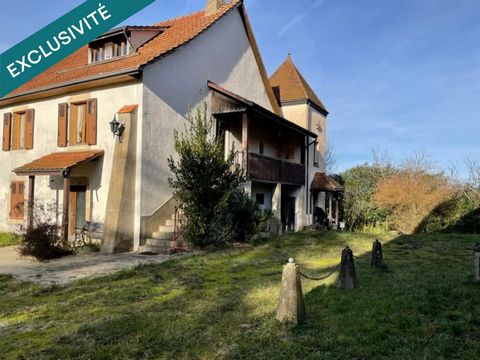 Ensemble de deux granges dont une avec habitation.