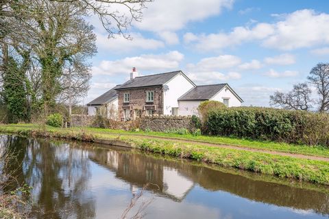 A quintessential country cottage with stone and rendered elevations under a slate roof. The cottage is situated alongside the Brecon and Monmouth Canal on the fringe of an historic village, the interior is as pretty as the exterior, tastefully presen...