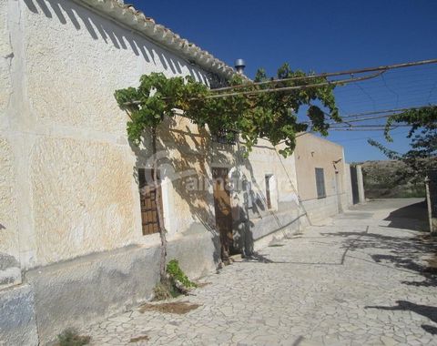 A terraced two storey Cortijo with garden space and garage/warehouse for sale in the area of Saliente Bajo near to Albox. The property has land to the front with a concrete driveway and an enclosed garden space between the house and garage/ warehouse...