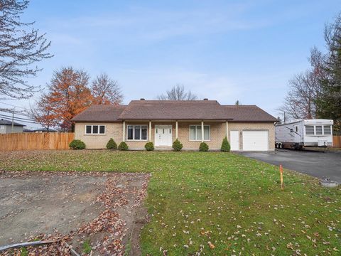 Ranch style bungalow home of three bedrooms and larger attached garage, very bright rooms, all stained hardwood or ceramic floors, many recent updates. 27,000 plus square feet lot, huge semi-fenced back yard with cedar edges, parking for eight plus v...