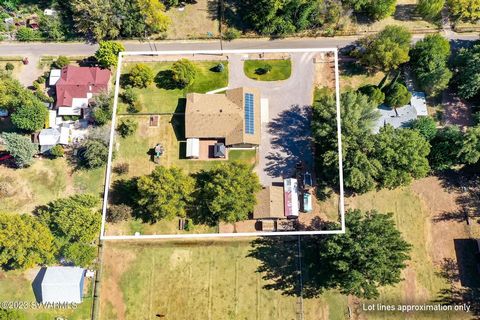 Green Acre...This beautiful 1 acre lot is in a prime location to access all the amenities Cottonwood has to offer. Rich green irrigated lot, Fruit Trees, areas to Garden, Chicken Coop, Paid for Solar Package, Large 900 sq ft detached garage for the w...