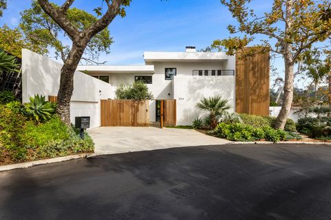 Extraordinary architectural triumph in coveted Santa Monica Canyon. Nestled on Amalfi Dr this stunning modern masterpiece has been completely remodeled to the most discerning standard. Upgrades include Bofi Kitchen with Gaggenau appliances, Antonio L...
