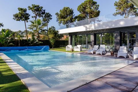 The villa has 6 bedrooms and is built on three floors for a total area of 500m2. An impressive pivoting entrance door opens onto the social area, where there is an imposing social room with a bioethanol fireplace, a fully equipped kitchen with high-e...