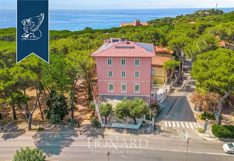 This elegant seafront villa is for sale on the Tuscan coast in Castiglioncello. Surrounded by a leafy pine forest, the villa spans five levels and offers 671 sqm of internal space, currently divided into suites and independent flats, ideal for touris...