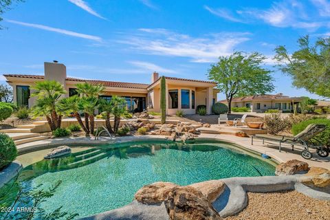 Welcome to your dream home, nestled in the highly sought-after Tonto Verde community. GOLF COURSE MEMBERSHIP available for purchase. This bright and energetic 3,949 sq. ft. residence offers breathtaking views of the fairway and Four Peaks from its ex...