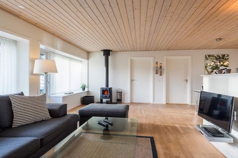 This charming holiday home offers a cozy and comfortable retreat with two spacious bedrooms, each furnished with a double bed for a restful sleep. The living room features a wood-burning stove, a radio, and a CD player, creating a warm and inviting a...