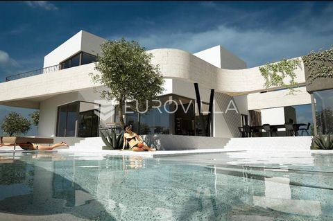 Vodice, beautiful and spacious villa with a swimming pool with a total area of 730.25 m², on a plot of 1499 m². The villa is spread over 3 floors, and is currently in the unfinished phase and is being sold as such. It is also possible to arrange a tu...