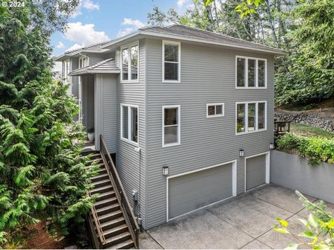 Welcome to your private oasis nestled in the NW Portland Hills. Uniquely situated in a secluded forest-like setting with breathtaking valley and sunset views, this striking contemporary home offers a rare blend of privacy and convenient access to loc...