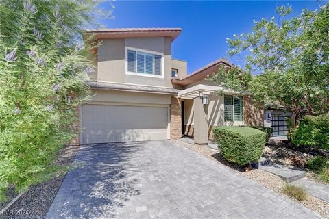 Nestled within the gated community of Vistara in Summerlin South, this immaculate four bedroom, three bathroom home is where luxury meets modern living. Step inside to find designer shutters that complement the bright, open-concept floorplan, creatin...