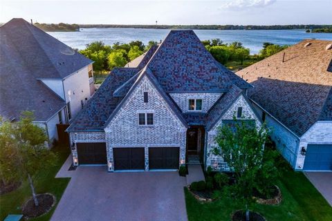 LAKE VIEW and located in highly sought after neighborhood The Tribute, this Highland built home is absolutely beautiful! 5 bds, 4 full bths, 2 hlf baths and 3 car garage, this floor plan has everything. Upon entering you are greeted by luxurious feat...